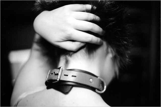 BDSM tasks: a woman wears a daily collar