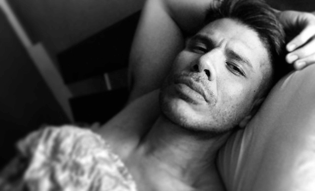 man lying on the bed ready for dirty talk