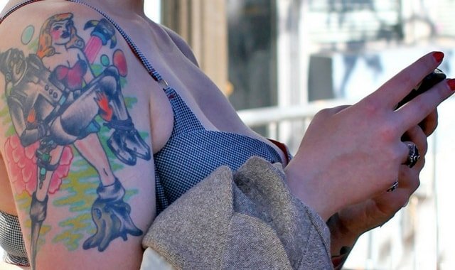 Woman with BDSM tattoo at Folsom Street San Francisco