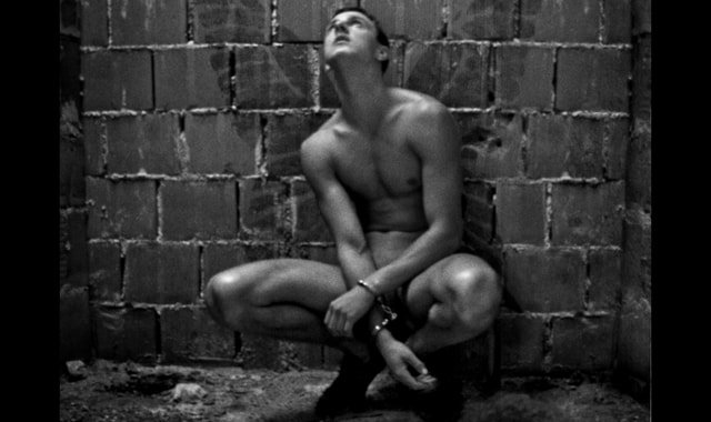 Man wearing handcuffs in a room