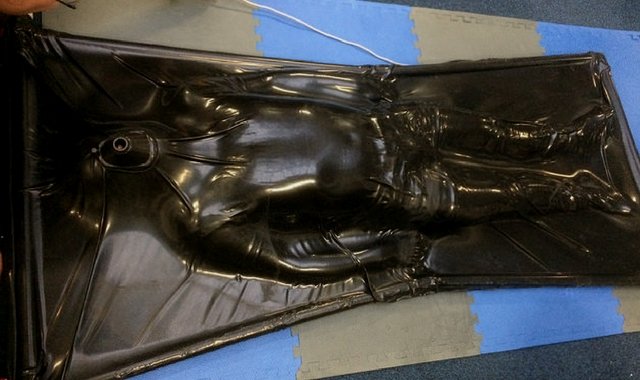 Restrained in a latex vacbed