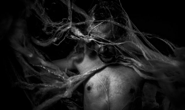 Man caught in a web. Spider fetish