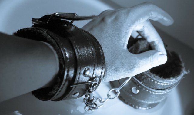 A pair of leather cuffs