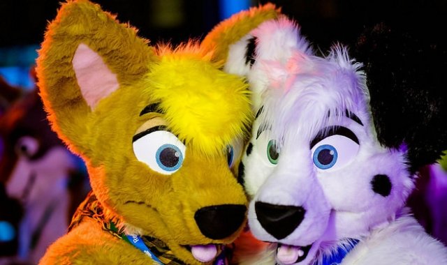 Image of two furries at a conference
