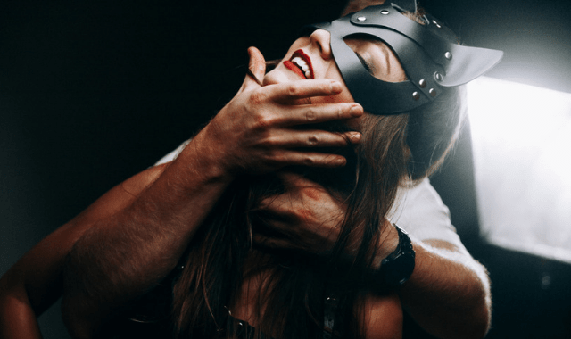 BDSM play party couple