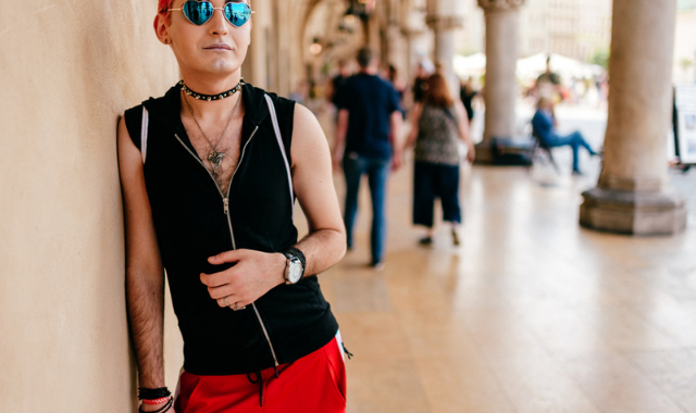 man wearing fetish clothing collar outside