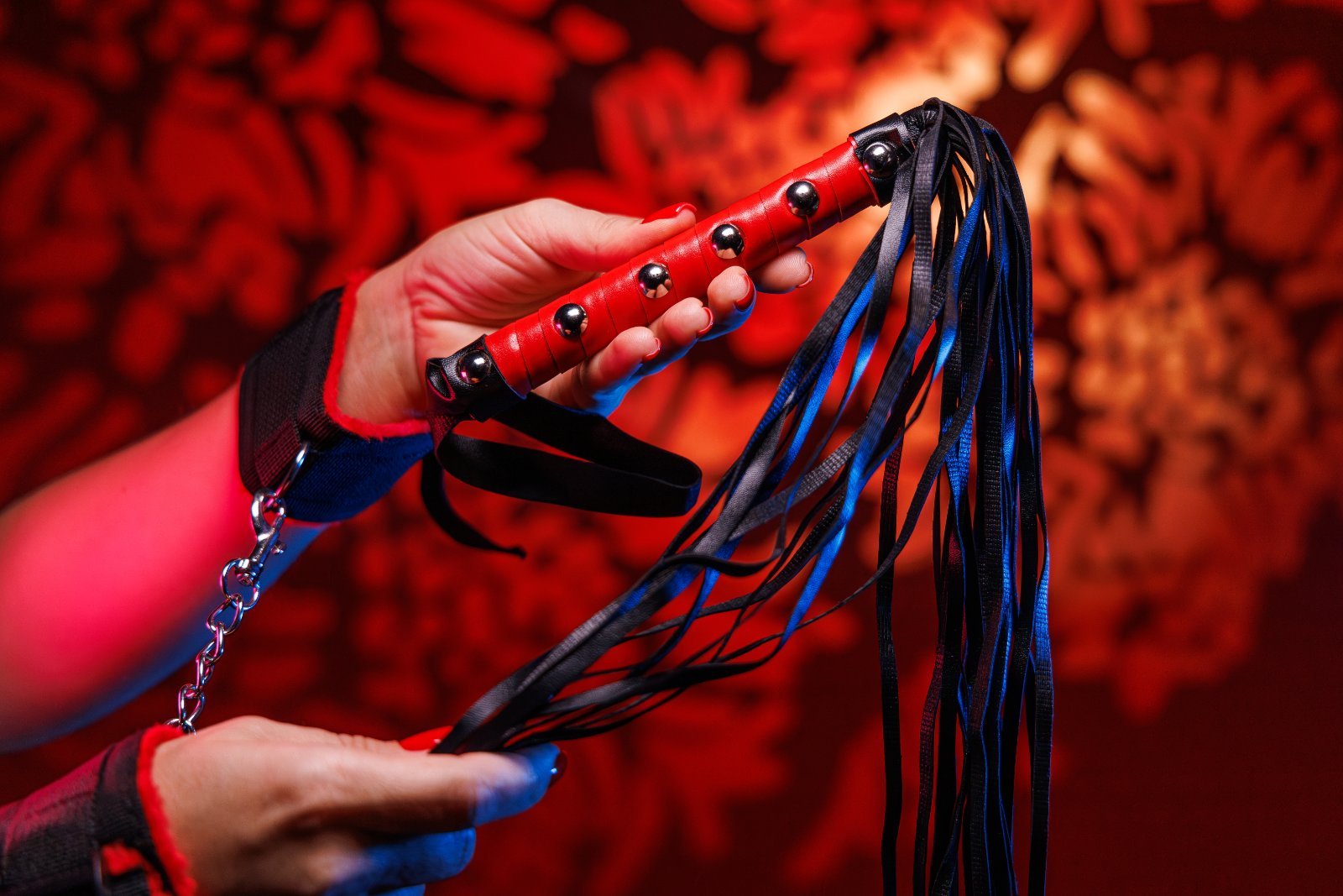 hand-holding-a-black-and-red-whip-2026-03-20-00-45-54-utc.jpg